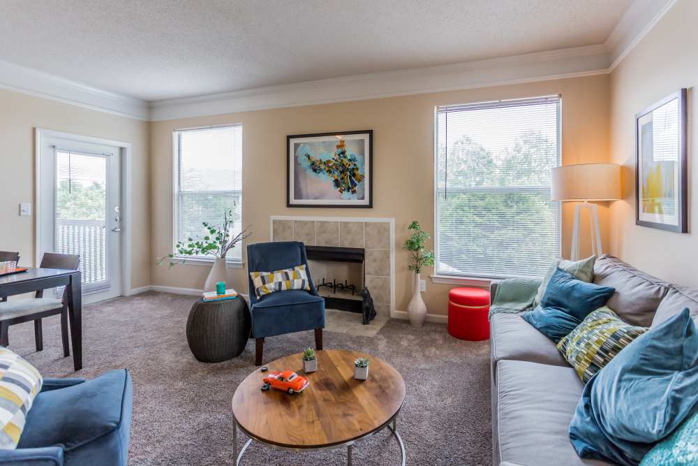 living room with carpet and fireplace