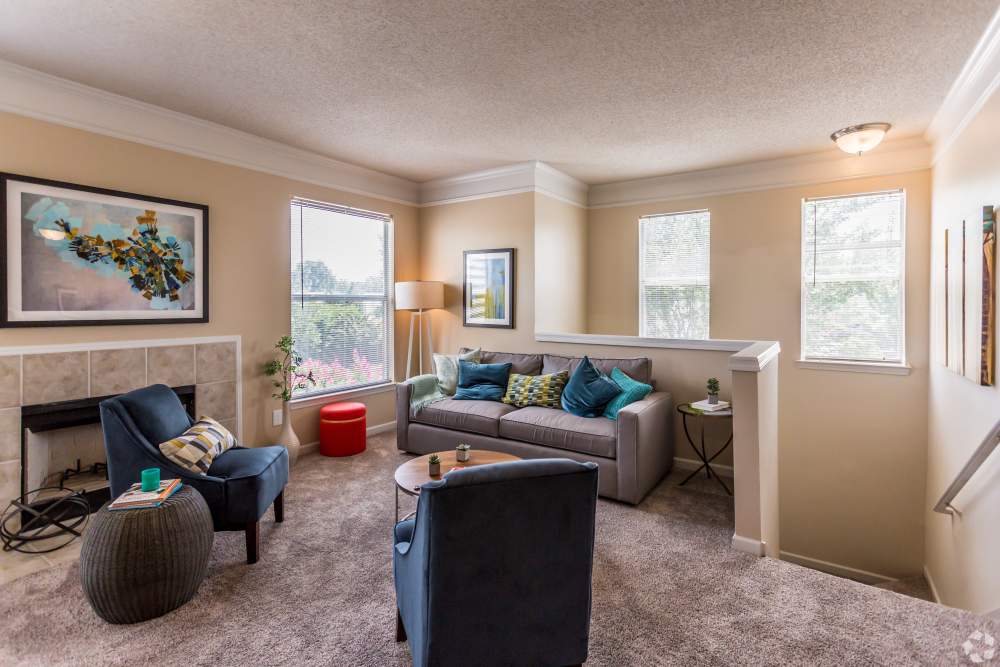 living room with carpet and fireplace