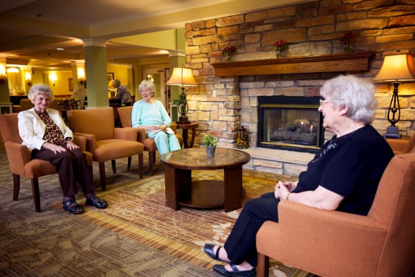 Residents relaxing in open living area at Someren Glen