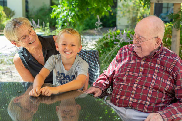 Senior citizen enjoying a moment with her grandson at Merrill Gardens at Rolling Hills Estates in Rolling Hills Estates, California