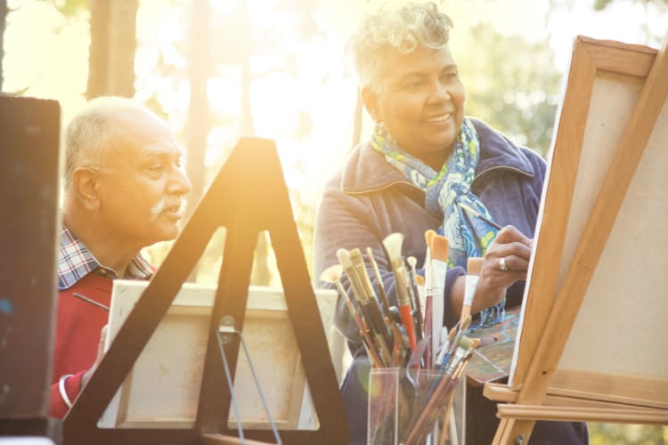 Residents painting together at Autumn Grove Cottage at Humble in Humble, Texas