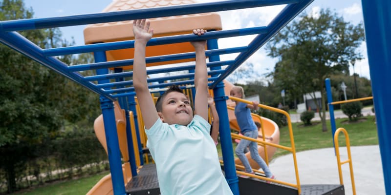 Children playing at a playground near Wire Mountain III in Oceanside, California