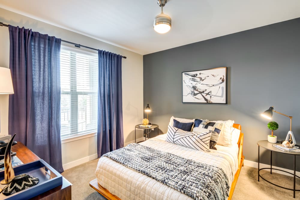 Comfy and naturally lit bedroom at Flats At 540 in Apex, North Carolina