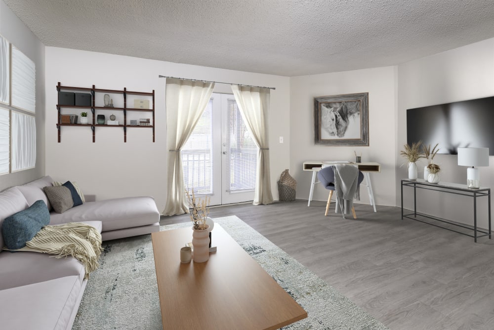 Living room with carpeting and ceiling fan at HighPointe Apartments in Birmingham, Alabama