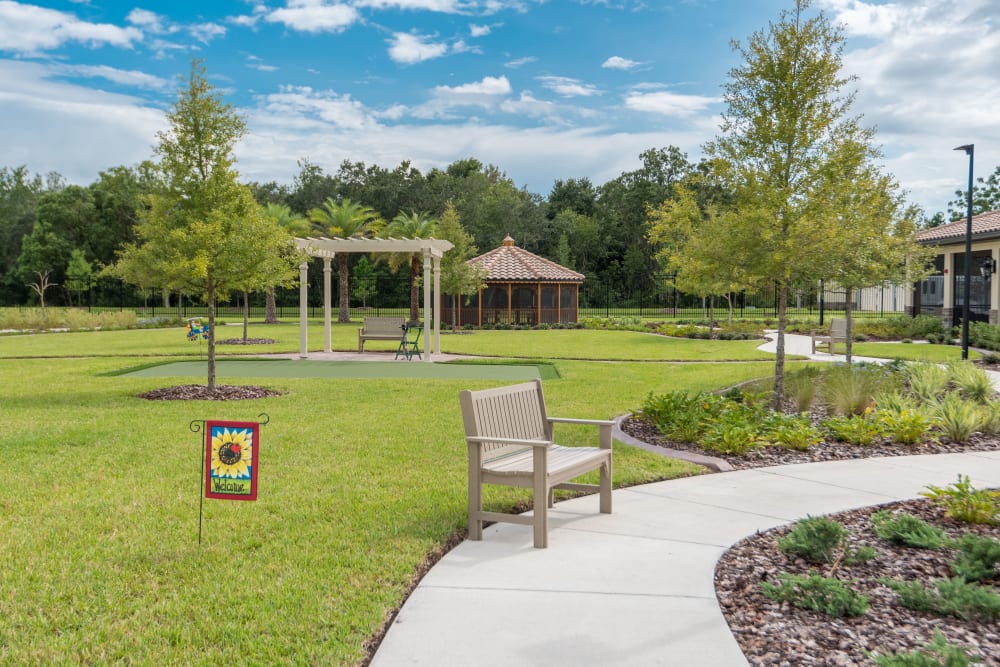 Outdoor covered benches at Inspired Living Ocoee in Ocoee, Florida