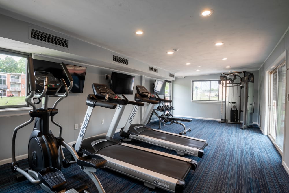 Fitness center with cardio equipment and weight machines at Glen Ridge Apartment Homes in Glen Burnie, Maryland