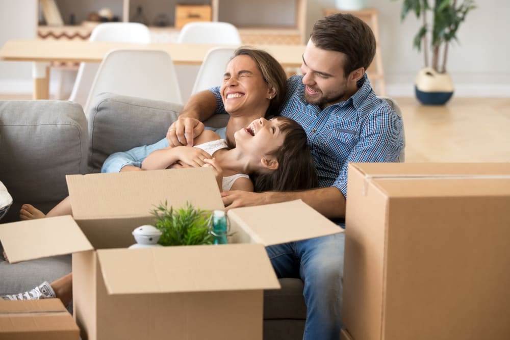 Family preparing items for storage in Spring, Texas at Devon Self Storage