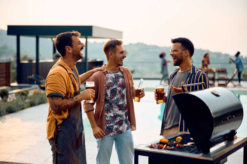 Friends enjoying beers and BBQ on our rooftop at Union Terminal Warehouse in Jacksonville, Florida