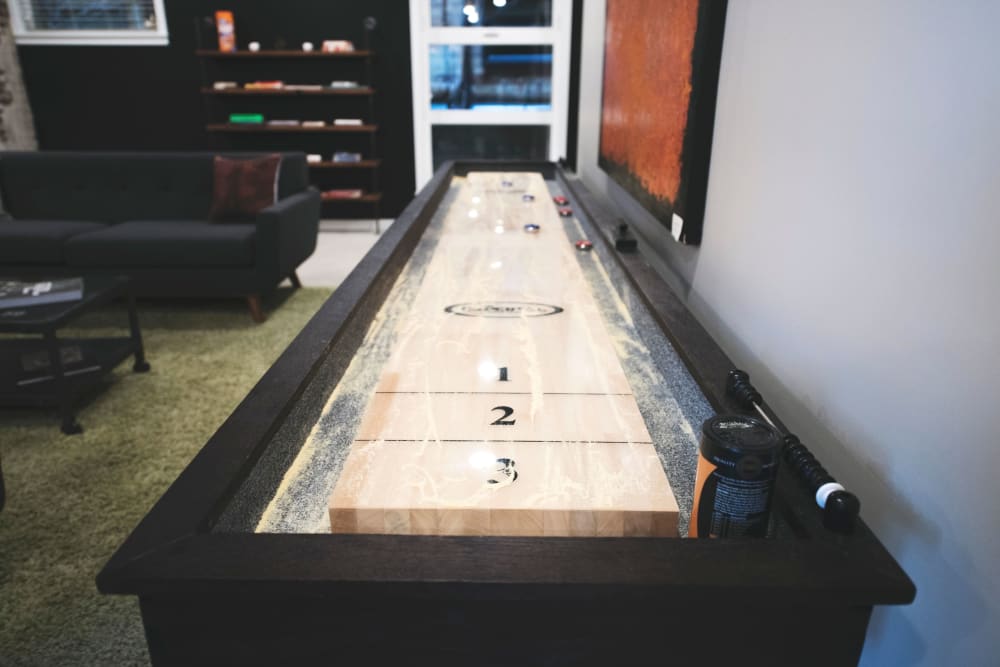 Tabletop shuffleboard and more in the clubhouse game room at Brooklyn Yard in Portland, Oregon