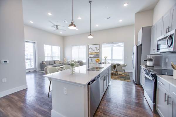 Modern kitchen with stainless steel appliances and granite countertops