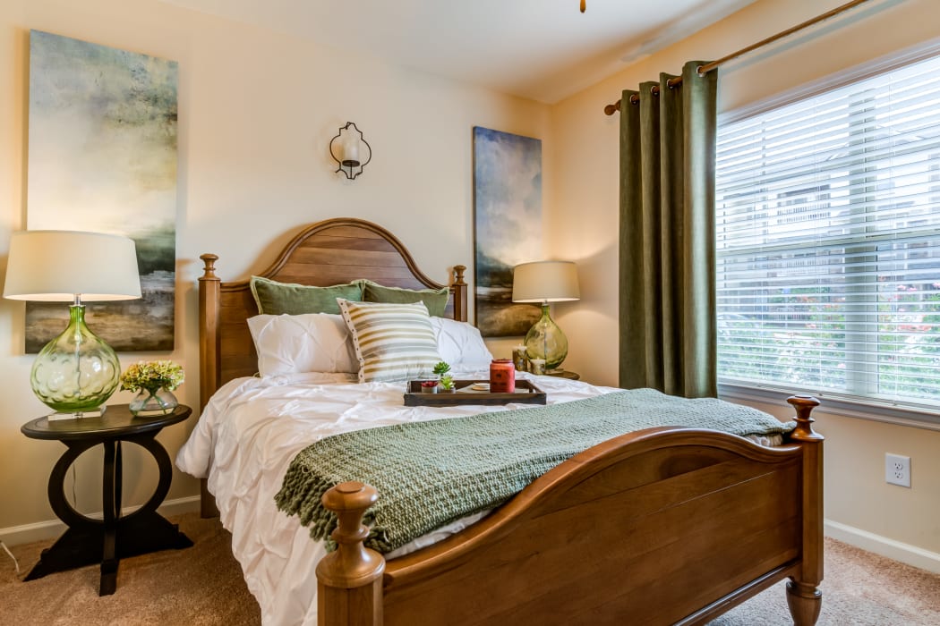 Bedroom with large windows in a model home at Commonwealth at 31 in Spring Hill, Tennessee