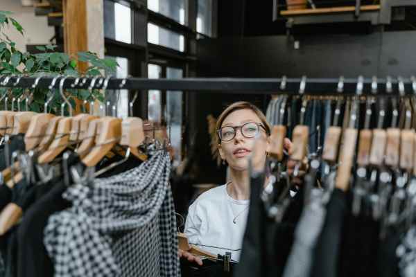 Woman shopping cloths at Costa Bella in San Antonio, Texas