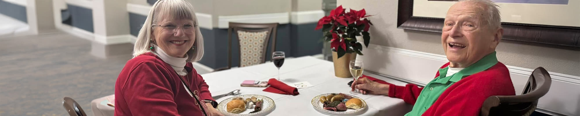 A senior couple dining together at Isle at Cedar Ridge in Cedar Park, Texas, enjoying each other's company.