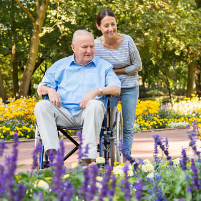 resident enjoying a stroll in the garden at Ashbrook Village in Duncan, Oklahoma