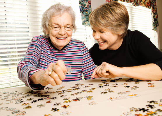 Wyndham Court of Plano resident puts together a puzzle with her daughter in Plano, Texas