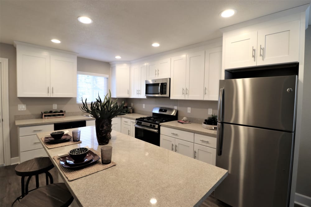 Beautiful kitchen with island at Pinebrook Apartment Homes in Fremont, California