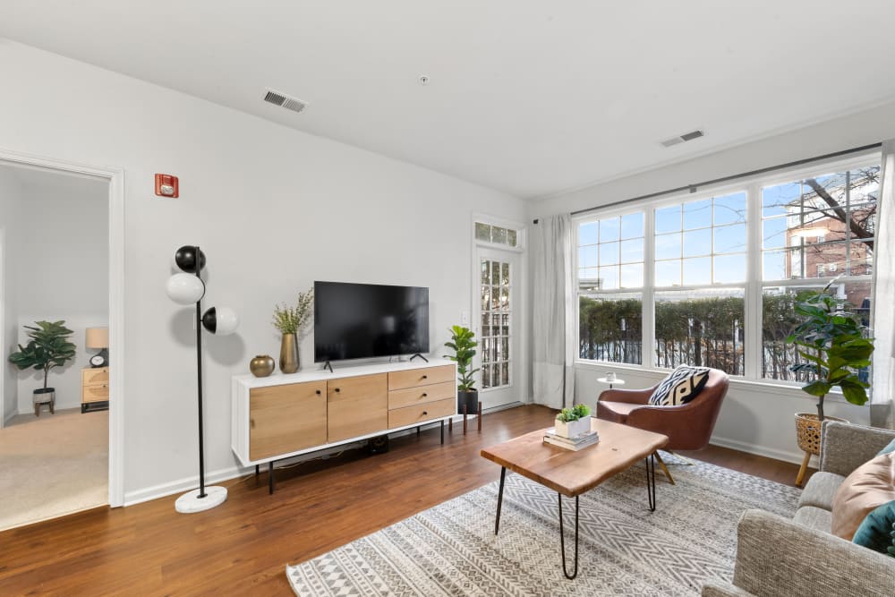 Spacious and well lit living room in a model home at Sofi Lyndhurst in Lyndhurst, New Jersey