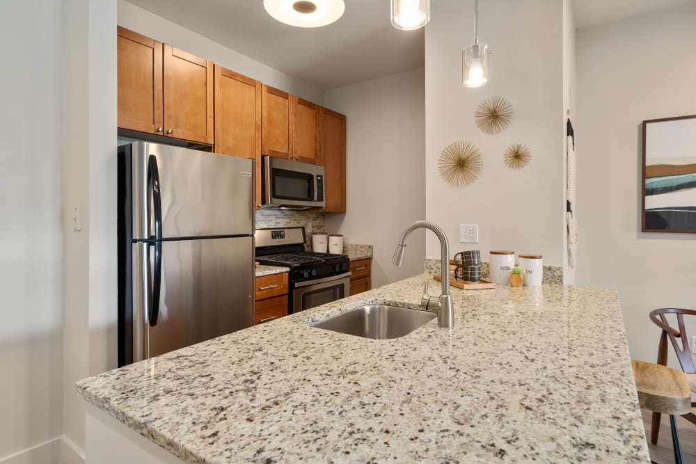 Kitchen and dining area at Sofi Parc Grove in Stamford, Connecticut