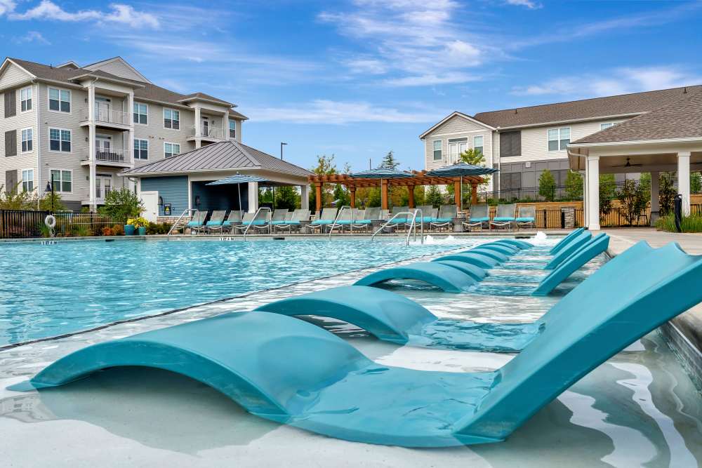 Outdoor fireplace lounge at Gibson Flowery Branch | Apartments in Flowery Branch, Georgia