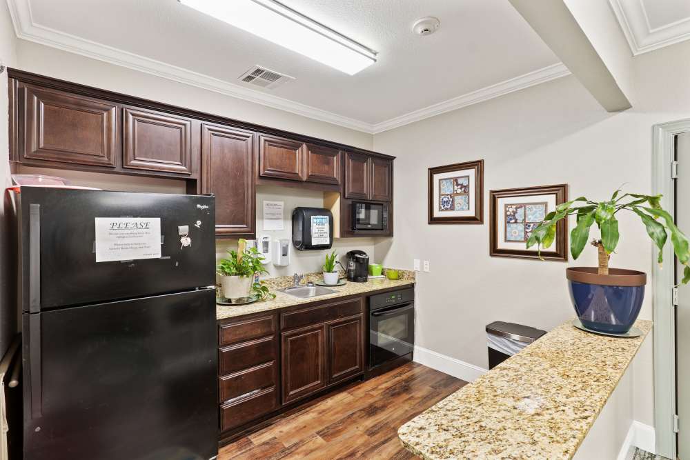 A kitchen in one of the apartments at Isle at Watercrest Bryan in Bryan, Texas