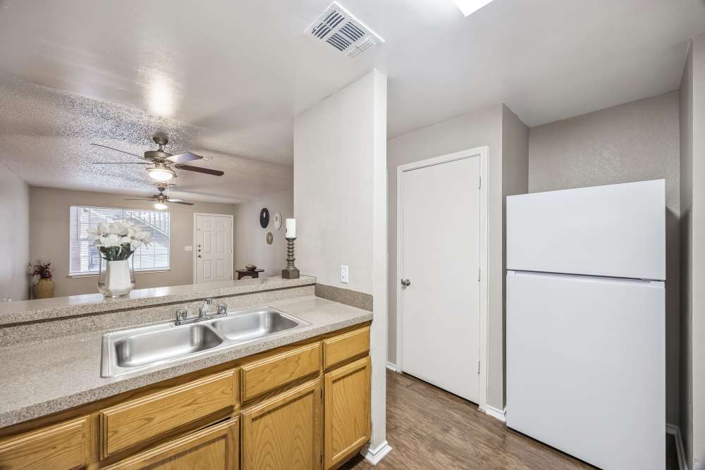 Kitchen with granite countertops at Cameron Village Apartments in Alice, Texas
