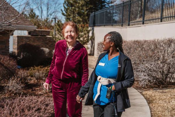 Our resident taking an outdoor walk at Highline Place in Littleton, CO