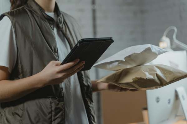 Woman scanning the parcel at Wesley in Raleigh, North Carolina 