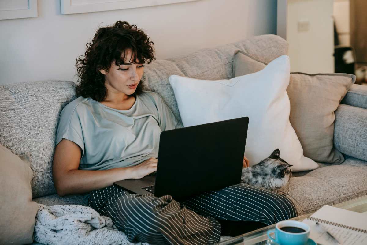 Resident woman working on her laptop at Willow Creek Townhomes in Jonesboro, Arkansas
