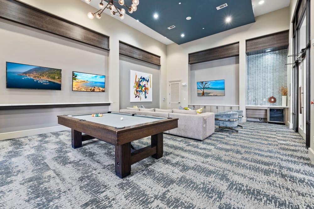 Pool table and TVs in the luxury clubhouse at Olympus at Memorial in Houston, Texas