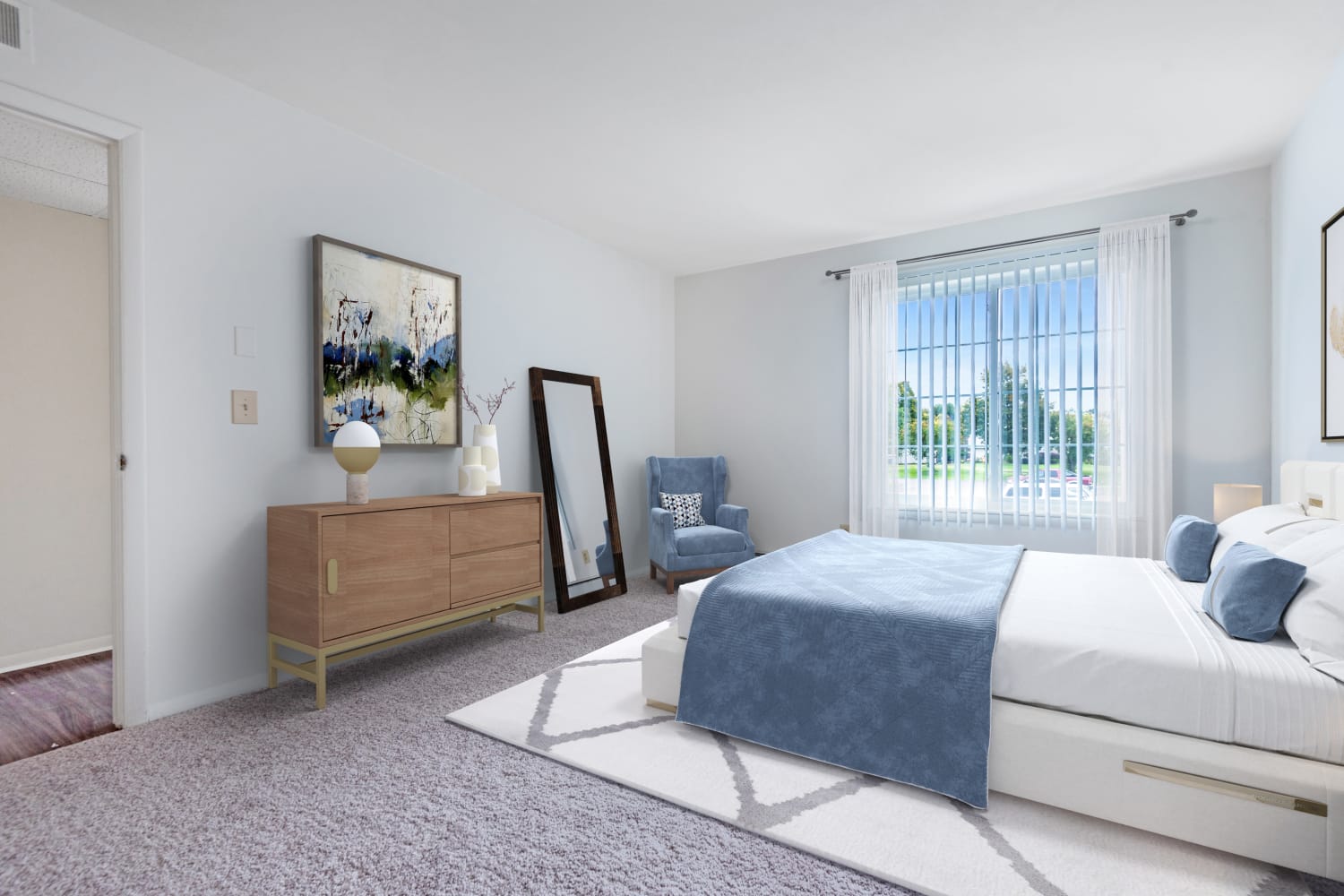 Modern, bright bedroom at Steeplechase Apartments in Camillus, New York.