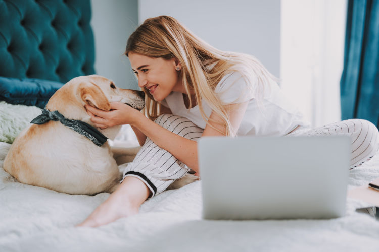 Resident and her dog loving their new home at Residences at the Triangle in Austin, Texas