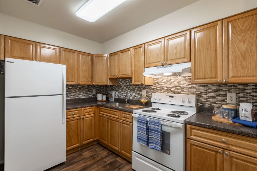 Kitchen with white appliance at The Willows Apartment Homes in Glen Burnie, Maryland