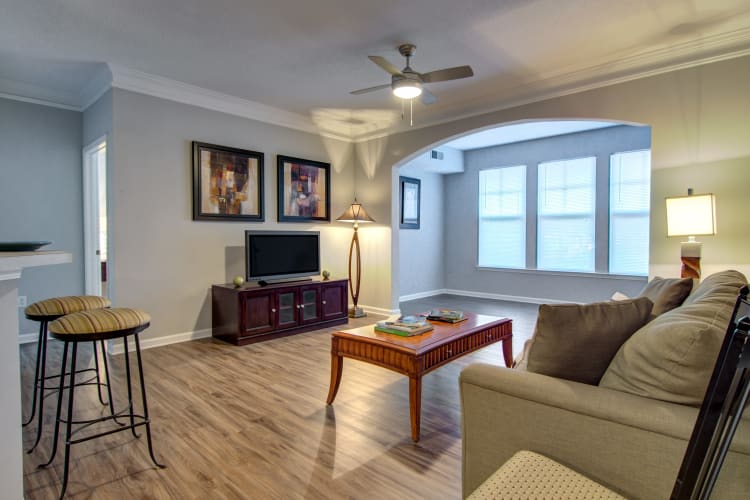 Well-decorated living area in an open-concept model home at Landing Square in Atlanta, Georgia