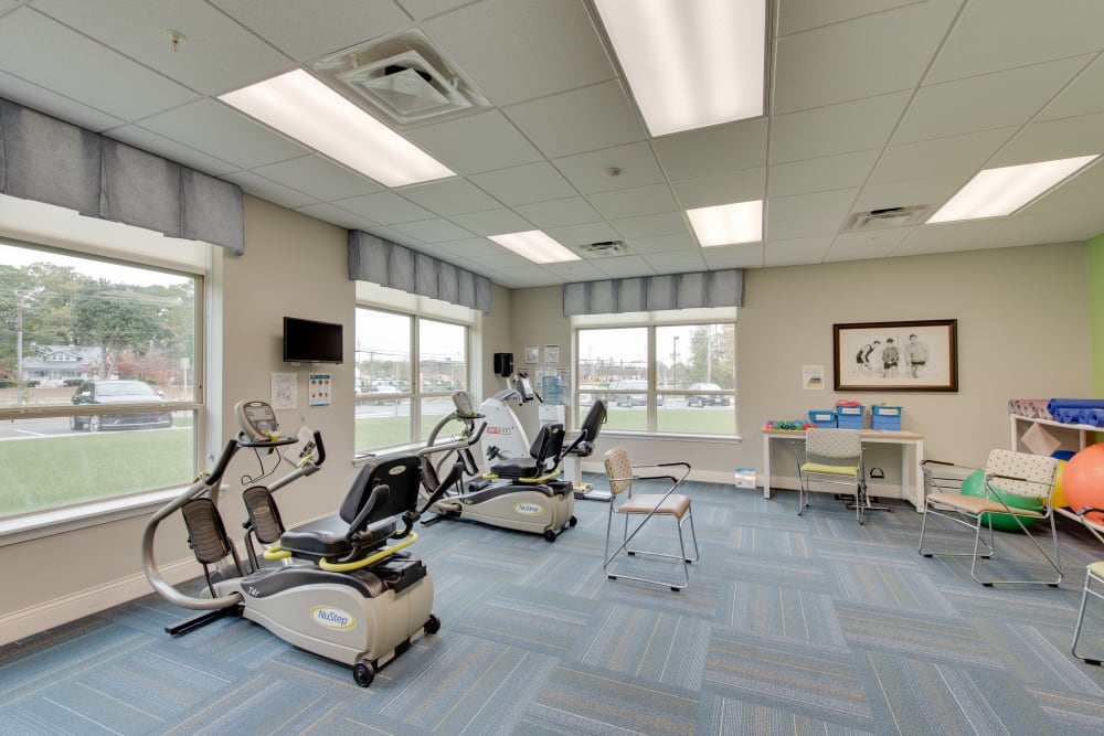 Exercise equipment in the gym at Harmony at Oakbrooke in Chesapeake, Virginia