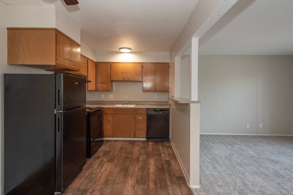 Spacious kitchen and living room at Arden Palms Apartments in Sacramento, California