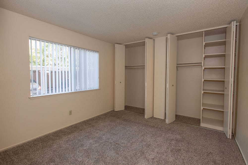Bedroom area with spacious closets at Coralaire Apartments in Sacramento, California