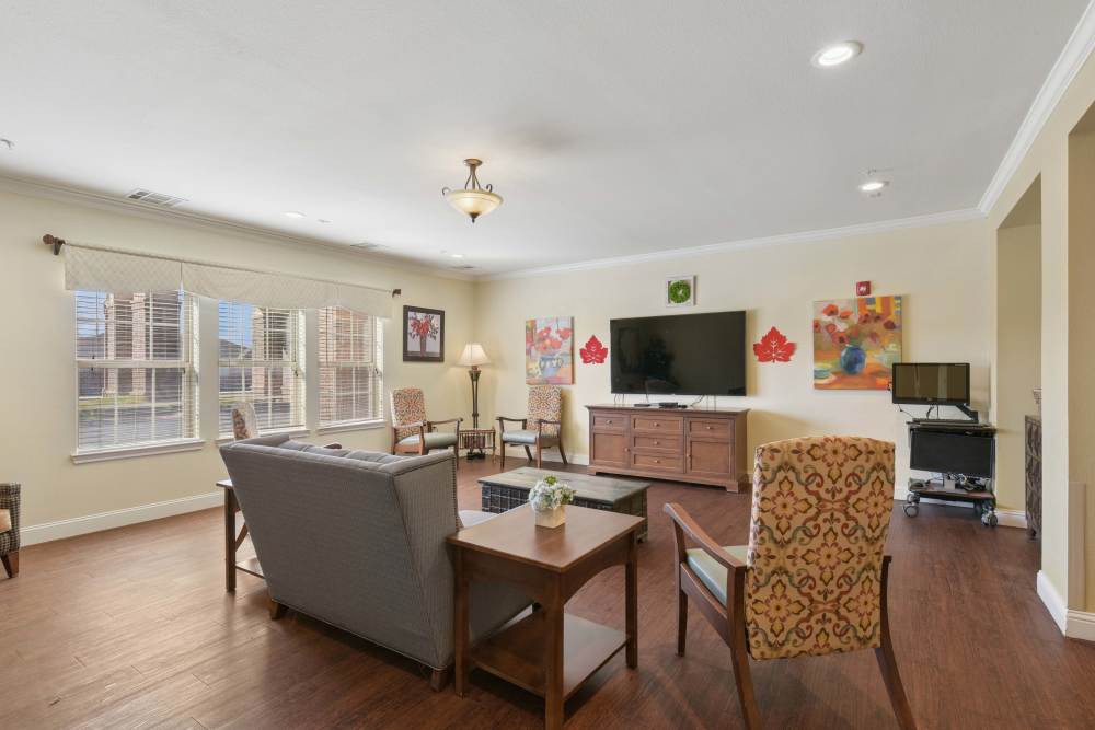 Cozy room with a TV at Isle at Raider Ranch in Lubbock, Texas