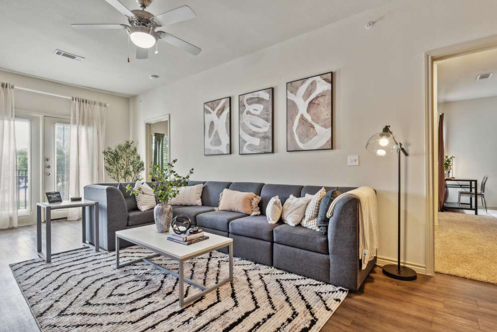 Living room in a student apartment at Midtown 905 in Denton, Texas