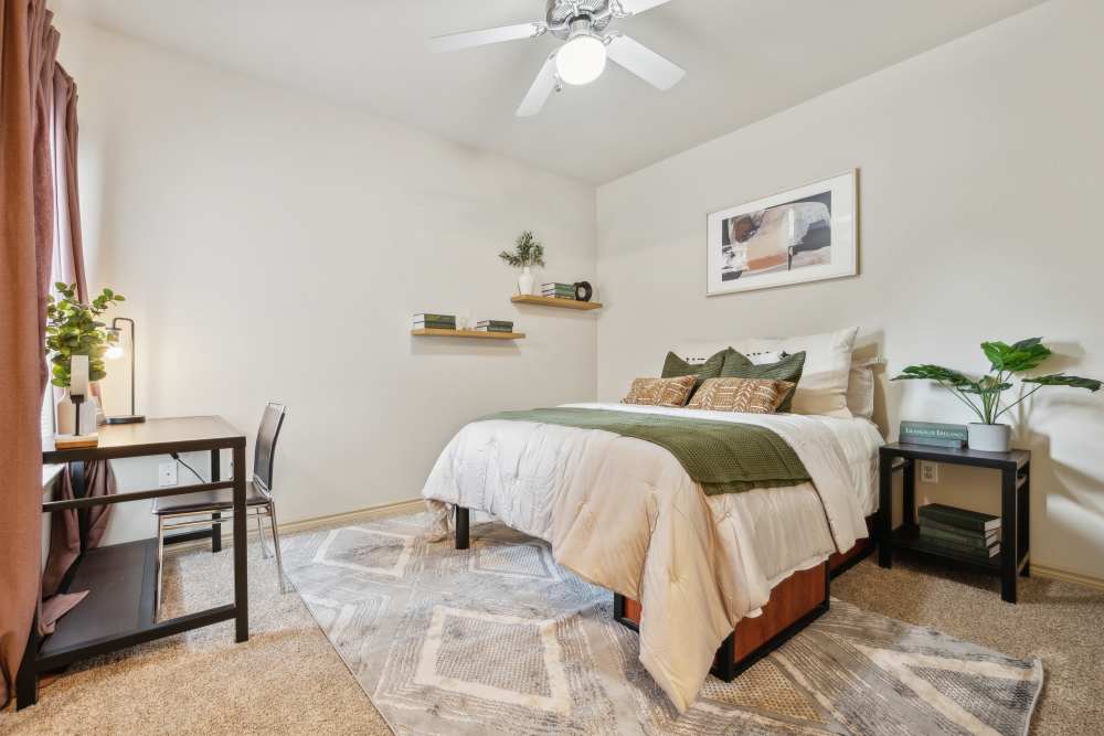 Bedroom with study table at Midtown 905 in Denton, Texas
