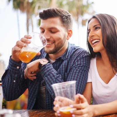 Couple having a drink on the patio of a bar near Motif Apartments in Lynnwood, Washington