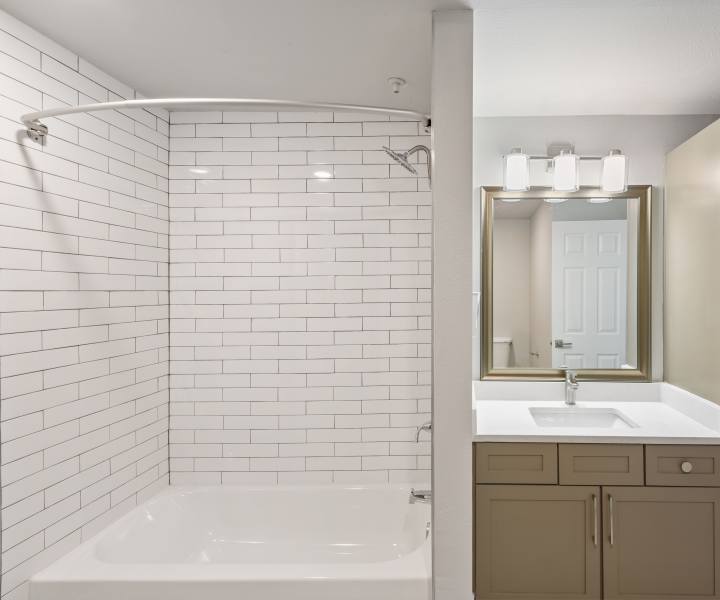 Bright bathroo with shower, tub and lots of storage space at Easton in San Antonio, Texas