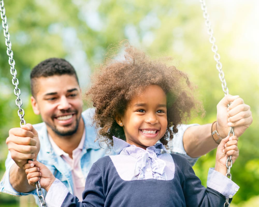 A father and his daughter at a playground near Madigan in Joint Base Lewis McChord, Washington