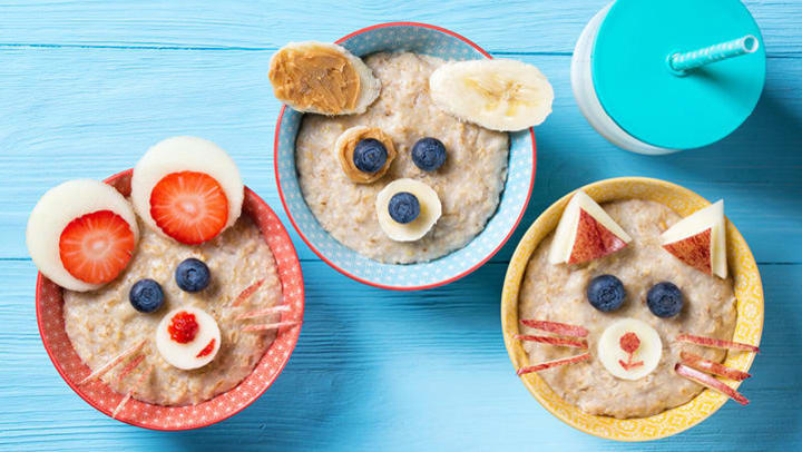 bowls of oatmeal made to look like animals