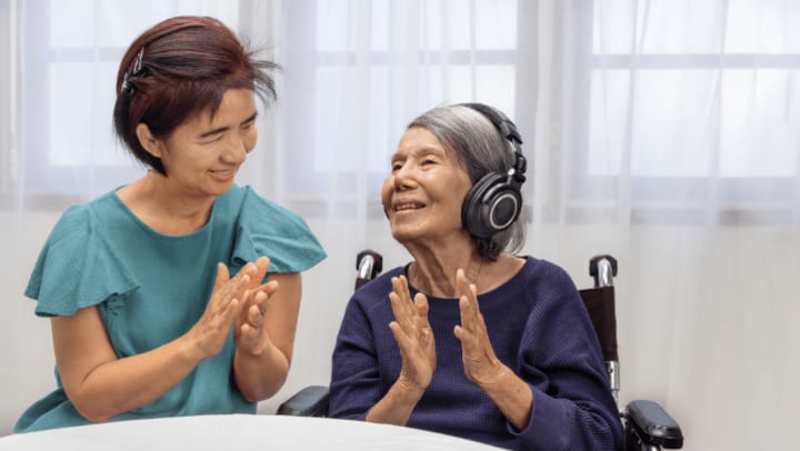 an old lady having a great time with her caregiver
