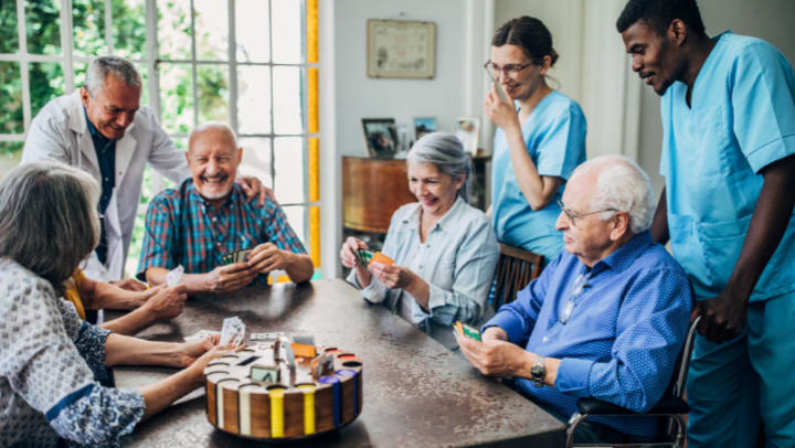 a group of seniors having a fun time playing a board game