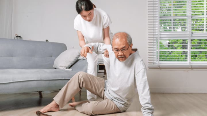 a nurse helping an elderly person