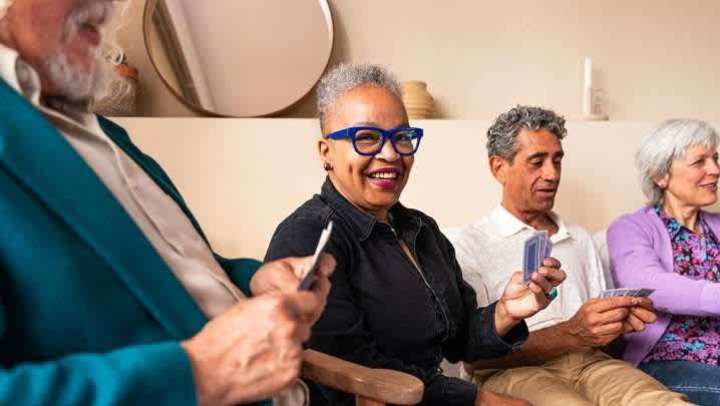 Seniors smiling as they lounge in the community