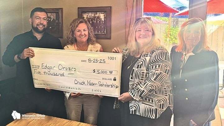 Edgar Orozco is presented with the Charles 