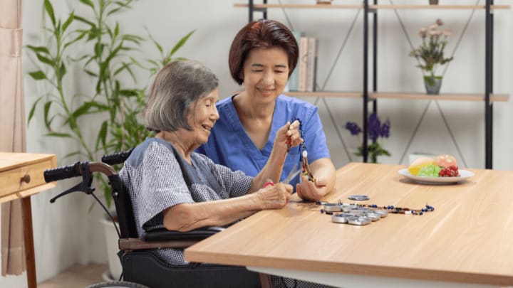 a nurse taking care from an older woman 