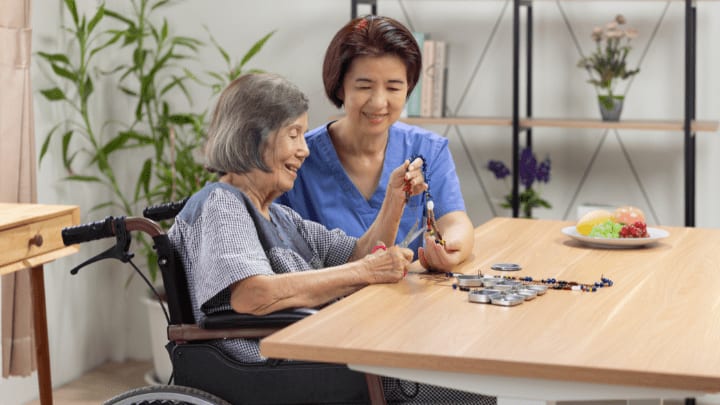a nurse and an old woman smiling